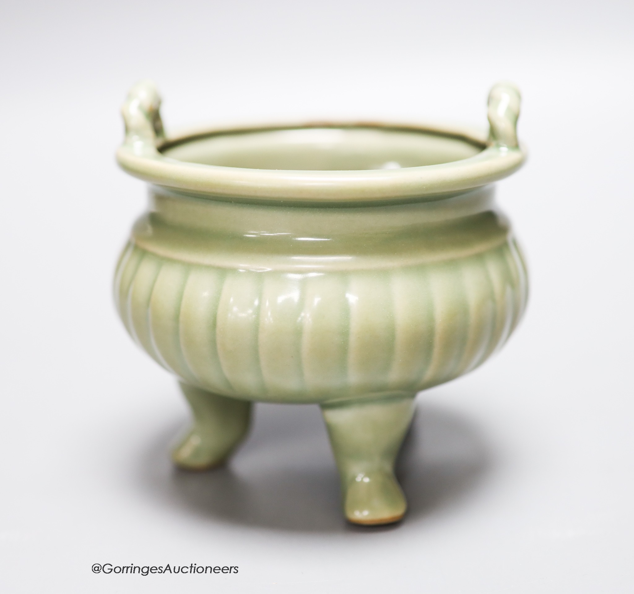 A Chinese celadon tripod censer, height 11.5cm